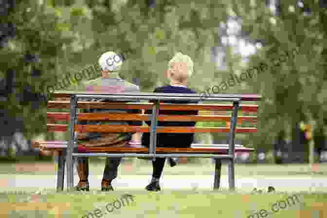 A Elderly Couple Sitting Hand In Hand On A Park Bench, Surrounded By The Golden Hues Of Autumn Leaves. Small Town Romances: Three Romances Of Life In A Small Town